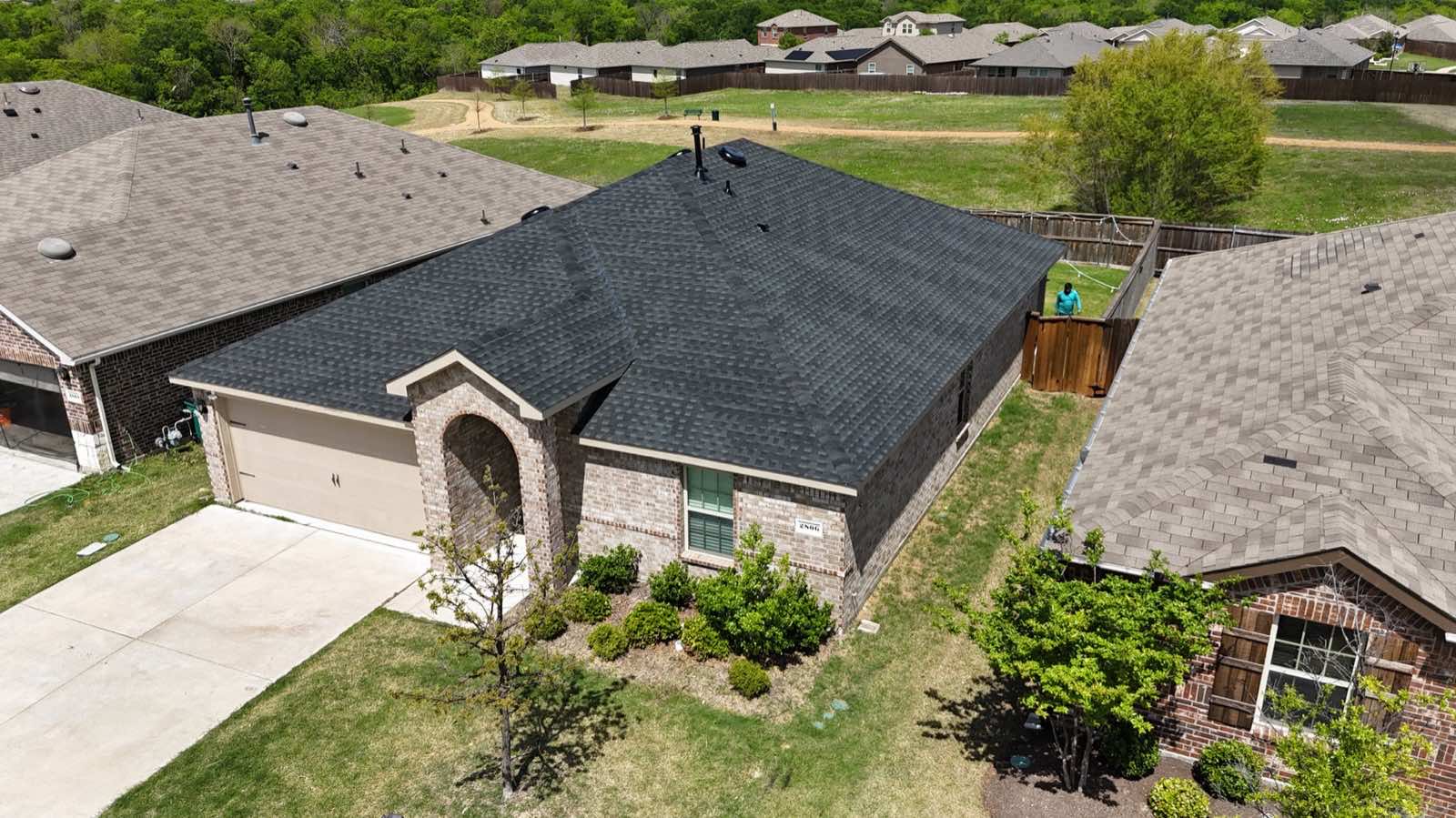 New dark shingle roof on a single-story home