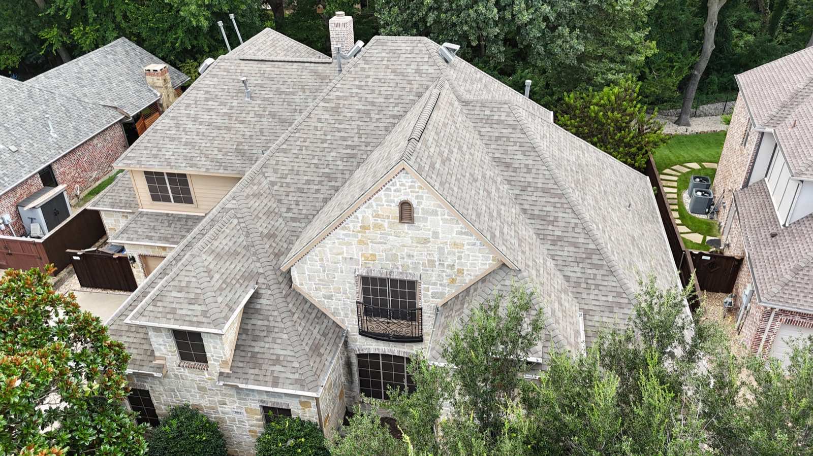 Limestone home with a new shingle roof